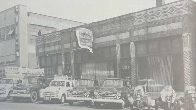 A background of older cars from the 1950s.